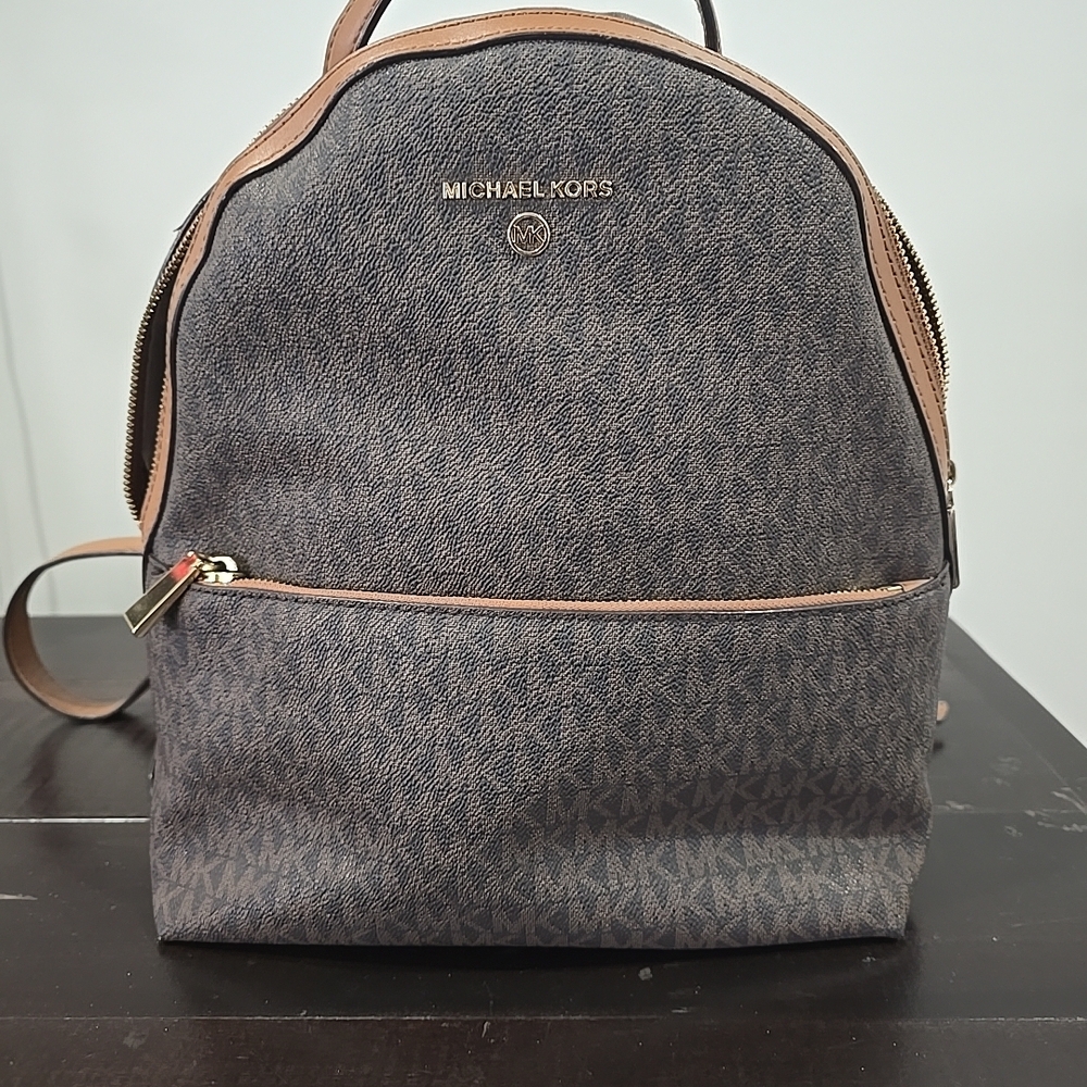 Michael Kors Valerie medium logo backpack in brown and acorn PVC and leather. 